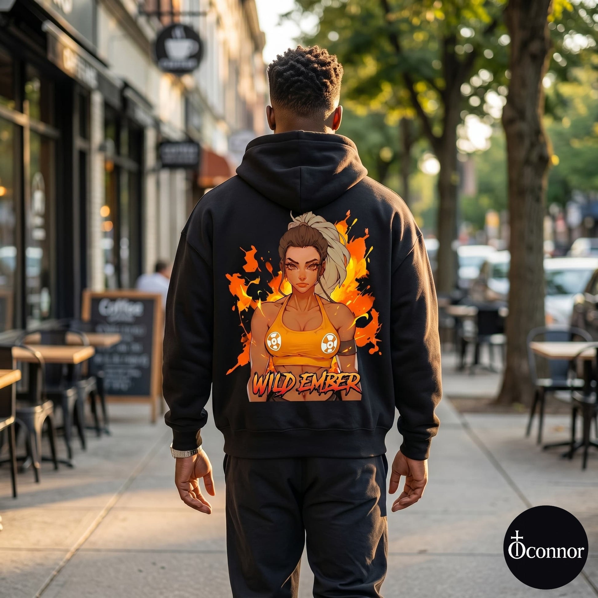 Male model wearing Wild Ember black hoodie seen from behind in urban setting with anime-style elements - O'Connor streetwear